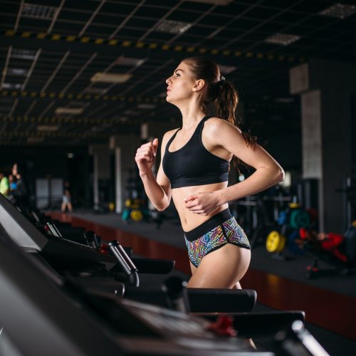 female-athlete-on-a-treadmill-in-sport-gym.jpg