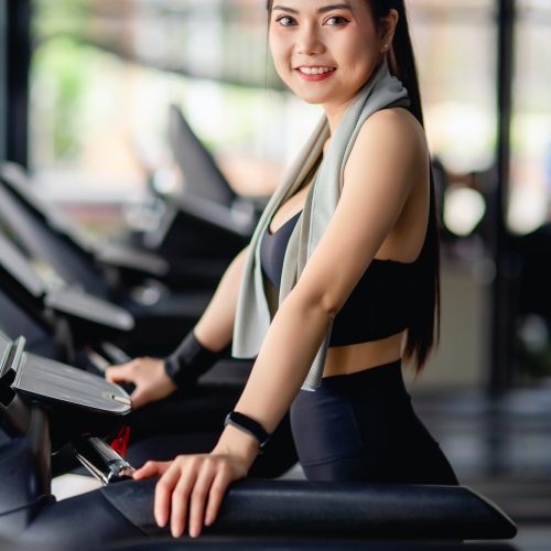 young-healthy-woman-on-treadmill-workout-in-gym.jpg